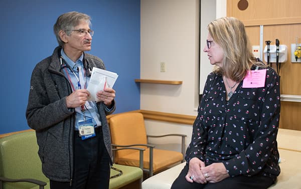 Dr. Friedman speaking to a patient.