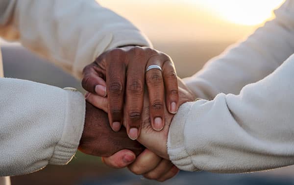 Two people holding hands.