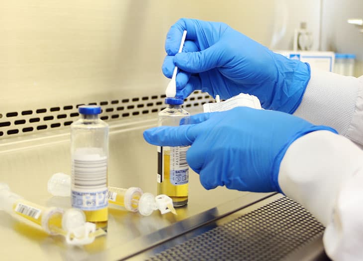 Lab technician taking a sample of platelets for further testing.
