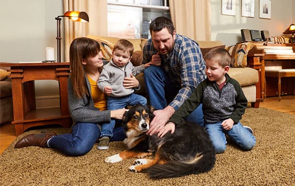 Family playing together in living room.