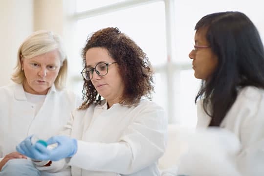 Researchers Collaborating on Research Findings