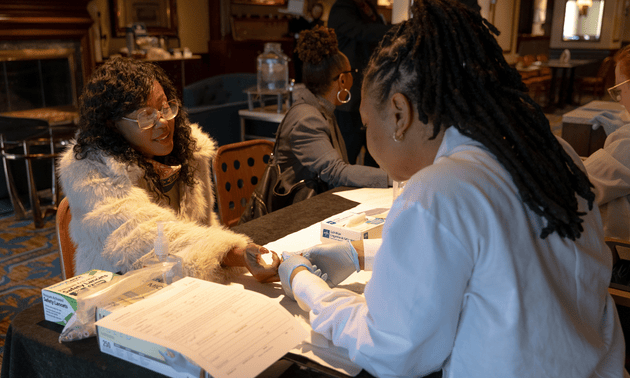 Before the program began, 21 attendees participated in complimentary blood typing, requiring only a finger poke, and many discovered something powerful. Six people learned they carry Ro blood, a rare subtype that's the safest possible transfusion partner for sickle cell warriors. 