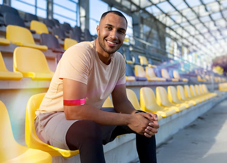Blood donor sitting in a stadium.