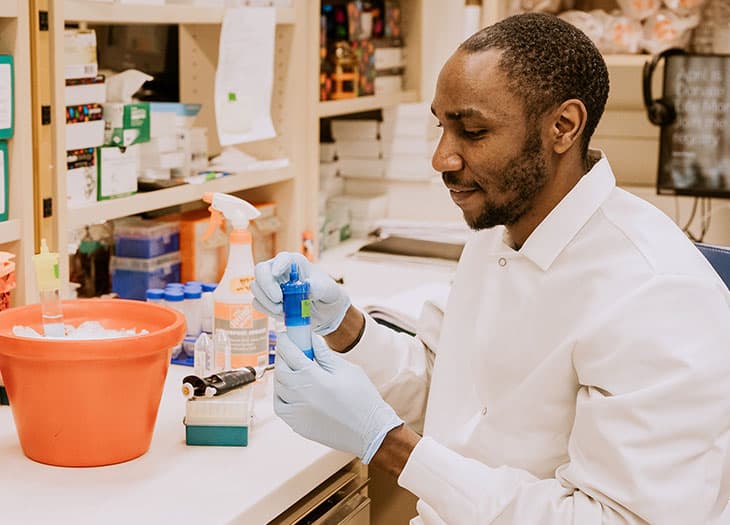 Reseacher closing a sample.